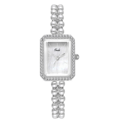 Montre à quartz créative pour femme avec perles de coquillage