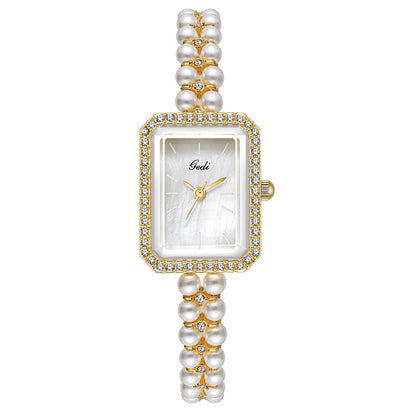 Montre à quartz créative pour femme avec perles de coquillage